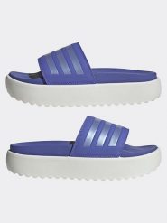 Adidas Klapki w kolorze fioletowo-białym rozmiar: 40,5. Różowe klapki damskie Adidas, bez wzorów, z otwartym noskiem, bez obcasa, bez zapięcia. Za 158.47 zł.