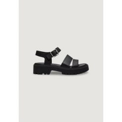 Buty sportowe Kobieta TIMBERLAND STST BACKSTRAP SANDAL. Czarne obuwie sportowe damskie Timberland, ze skóry, bez zapięcia. W wyprzedaży za 486.85 zł.