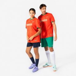 Koszulka piłkarska dla kibiców Maroko 2026. Czerwone bluzki damskie KIPSTA, s, bez wzorów, z materiału, sportowe, bez kołnierzyka, bez ramiączek. Za 44.99 zł.