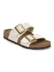 Birkenstock Klapki "Sydney" w kolorze złotym rozmiar: 36. Żółte klapki damskie Birkenstock, bez wzorów, z otwartym noskiem, bez obcasa, bez zapięcia. Za 439.24 zł.