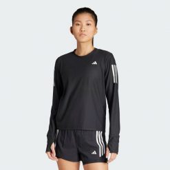 Koszulka Own The Run Long Sleeve. Fioletowe koszulki damskie Adidas, xs, bez wzorów, z materiału, bez kołnierzyka, bez ramiączek. Za 179.00 zł.