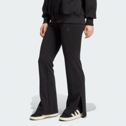 Spodnie Soft Lux Flared. Czarne rurki damskie Adidas, bez wzorów. Za 299.00 zł.