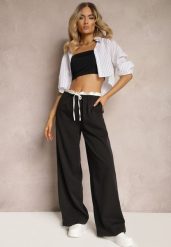 Czarne Materiałowe Spodnie z Szerokimi Nogawkami High Waist z Gumką w Talii Comina. Czarne spodnie materiałowe damskie Renee, bez wzorów, z jeansu. Za 119.99 zł.