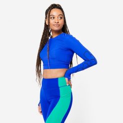 Koszulka fitness damska Domyos crop top długi rękaw. Niebieskie koszulki damskie DOMYOS, l, bez wzorów, z elastanu, bez kołnierzyka, bez ramiączek. Za 89.99 zł.