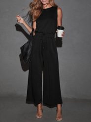 Milan Kiss Kombinezon w kolorze czarnym rozmiar: M. Czarne kombinezony damskie Milan Kiss, m, bez wzorów, bez kołnierzyka, bez ramiączek. Za 173.99 zł.