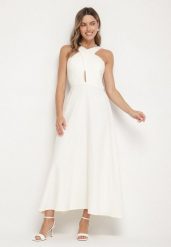Żółta Rozkloszowana Sukienka z Wiskozą i Dekoltem Typu Halter Dolienna. Żółte sukienki damskie Born2be, bez wzorów, z wiskozy, eleganckie, bez ramiączek. W wyprzedaży za 84.99 zł.