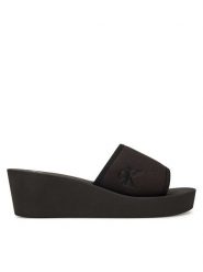 Calvin Klein Jeans Klapki Beach Wedge Slide Canvas YW0YW01725 Czarny. Czarne klapki damskie Calvin Klein Jeans, bez wzorów, z jeansu, bez obcasa, bez zapięcia. Za 139.99 zł.