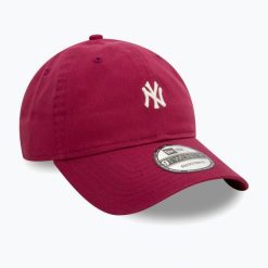 Czapka z daszkiem New Era Mini Washed 9Twenty New York Yankees. Czerwone czapki z daszkiem damskie New Era, bez wzorów. Za 119.99 zł.
