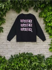 Bluza Beetlejuice - czarny. Czarne bluzy damskie Sinsay, l, bez wzorów, bez kaptura. W wyprzedaży za 24.99 zł.