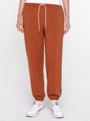 Puma Spodnie dresowe "Infuse" w kolorze jasnobrązowym rozmiar: M. Brązowe spodnie dresowe damskie Puma, m, bez wzorów, z dresówki. Za 135.49 zł.