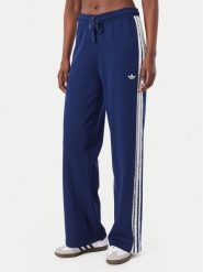 Adidas Spodnie dresowe Firebird KW2605 Niebieski Regular Fit. Niebieskie spodnie dresowe damskie Adidas, s, bez wzorów, z dresówki. Za 298.99 zł.