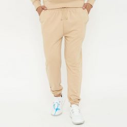 Spodnie sportowe unisex F BALLON beżowe. Brązowe obuwie sportowe damskie LEGEA, bez wzorów, z gumy. W wyprzedaży za 92.00 zł.