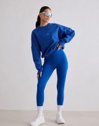 Damskie legginsy biegowe 7/8 wysoki stan, squat proof, kieszenie Le Run lazurowe. Niebieskie legginsy damskie Aim'n, xs, bez wzorów, z elastanu. Za 387.00 zł.