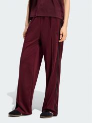 Adidas Spodnie dresowe Firebird Loose Tracksuit KS4669 Bordowy Loose Fit. Czerwone spodnie dresowe damskie Adidas, xs, bez wzorów, z dresówki. Za 298.99 zł.