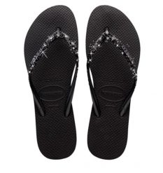 Klapki Havaianas Model Slim Glitter Ii Kolor Czarny. Czarne klapki damskie Havaianas, bez wzorów, z gumy, bez obcasa, bez zapięcia. Za 158.90 zł.