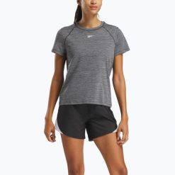 Koszulka Reebok Id Train Tee. Czarne koszulki damskie REEBOK FITNESS, bez wzorów, bez kołnierzyka, bez ramiączek. Za 79.99 zł.