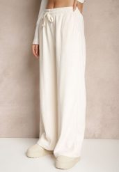 Białe Spodnie o Szerokim Kroju High Waist z Wiązaniem w Pasie Ettianne. Białe spodnie materiałowe damskie Renee, bez wzorów, z jeansu. Za 44.99 zł.