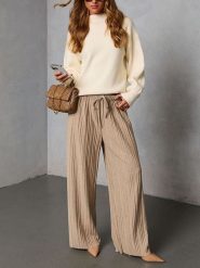 Milan Kiss Spodnie w kolorze beżowym rozmiar: XL. Brązowe spodnie materiałowe damskie Milan Kiss, bez wzorów, z materiału. Za 208.99 zł.