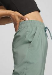 Damskie spodnie LACE PUMA Green Moon. Zielone spodnie sportowe damskie Puma, na wiosnę, l, bez wzorów, z tkaniny, z podwyższonym stanem, na fitness i siłownię. Za 252.05 zł.