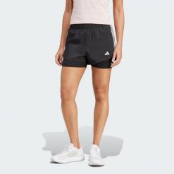 Szorty Pacer 3-Stripes Training Woven. Czarne obuwie sportowe damskie Adidas, z materiału, bez zapięcia, na fitness i siłownię. Za 179.00 zł.