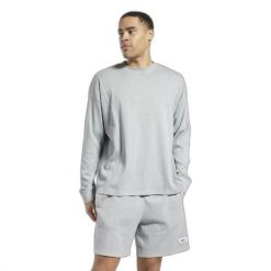 Bluza z dekoltem w kolorze naturalnym Reebok Classics. Szare bluzy damskie Reebok, s, bez wzorów, bez kaptura. W wyprzedaży za 236.85 zł.