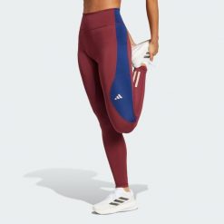 Legginsy Own The Run Colorblock Full-Length. Czerwone legginsy damskie Adidas, xl, bez wzorów, z materiału. W wyprzedaży za 216.75 zł.
