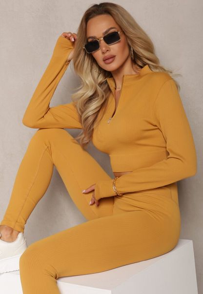 Żółta Elastyczna Bluzka na Suwak z Wycięciem przy Ściągaczu Denalla. Żółte bluzki damskie Renee, bez wzorów, bez kołnierzyka, bez ramiączek. Za 29.99 zł.