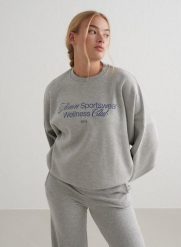 Damska bluza dresowa miękka, luźna, z okrągłym dekoltem Wellness szary melanż. Szare bluzy damskie Aim'n, m, bez wzorów, z bawełny, bez kaptura. Za 202.80 zł.