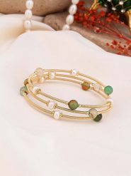 Pierres de Jade Pozłacana bransoletka z perłami i kryształami rozmiar: onesize. Białe bransoletki damskie Pierres de Jade, pozłacane. Za 43.99 zł.