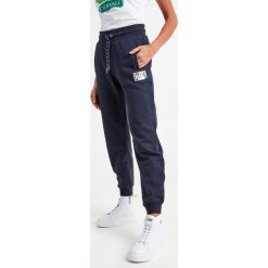 Spodnie dresowe damskie ARMANI EXCHANGE. Spodnie dresowe damskie Armani Exchange, l, bez wzorów, z dresówki. W wyprzedaży za 359.02 zł.