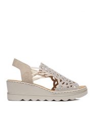 Rieker Sandały CEO-67465-62 Beżowy. Brązowe sandały damskie Rieker, bez wzorów, ze skóry, bez obcasa, na koturnie, bez zapięcia. Za 319.99 zł.