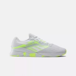 Sneakersy damskie Reebok Nano X4 buty sportowe treningowe tenisówki białe/żółte. Białe obuwie trekkingowe damskie Reebok, bez zapięcia. Za 449.00 zł.