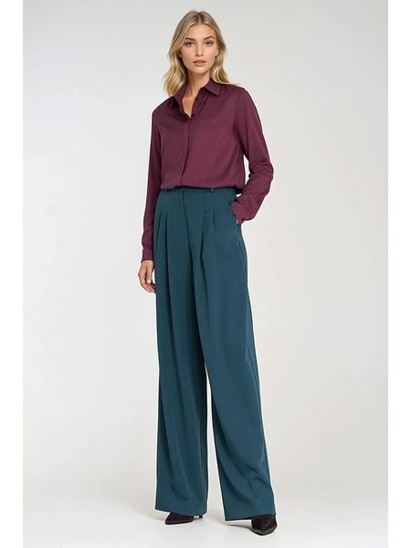 Nife Spodnie w kolorze niebieskim rozmiar: 42. Niebieskie spodnie materiałowe damskie Nife, bez wzorów, z materiału. Za 178.79 zł.