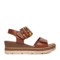 Sandały Remonte. Brązowe sandały damskie Remonte, bez wzorów, bez obcasa, na koturnie, bez zapięcia. Za 379.99 zł.