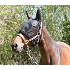 Czapka dla koni wypasanych na pastwisku T de T. Czarne czapki damskie T DE T, bez wzorów. Za 175.50 zł.