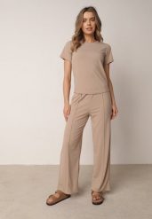 Beżowe Szerokie Spodnie z Prążkowanej Tkaniny z Wysokim Stanem Sarora. Brązowe spodnie materiałowe damskie Born2be, bez wzorów, z jeansu. Za 59.99 zł.