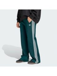 Adidas Spodnie dresowe Firebird KG3701 Zielony Loose Fit. Zielone spodnie dresowe damskie Adidas, xl, bez wzorów, z dresówki. Za 299.99 zł.