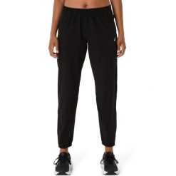 Damskie spodnie dresowe Asics Core. Czarne spodnie sportowe damskie Asics, l, bez wzorów, z dresówki, na fitness i siłownię. Za 324.00 zł.