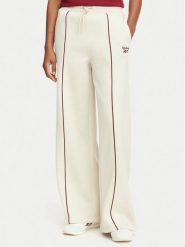 Reebok Spodnie dresowe Oliwia RK25683CCW Beżowy Regular Fit. Brązowe spodnie dresowe damskie Reebok, s, bez wzorów, z dresówki. Za 199.99 zł.