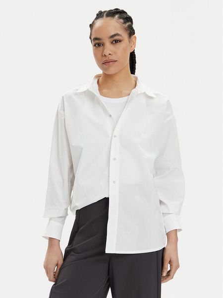 Champion Koszula 117204 Biały Oversize. Białe koszule damskie Champion, l, bez wzorów, z bawełny, bez kołnierzyka, bez ramiączek. Za 219.99 zł.