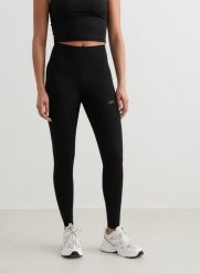 Damskie legginsy z wysokim stanem, odprowadzające pot Sculpting czarne. Czarne legginsy damskie Aim'n, s, bez wzorów, z lycry. Za 203.40 zł.