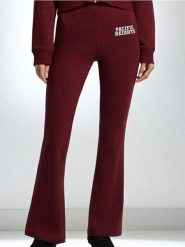 Spodnie flare - bordowy. Czerwone spodnie sportowe damskie Sinsay, l, bez wzorów. Za 39.99 zł.