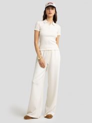 BIG STAR Koszulka polo w kolorze kremowym rozmiar: S. Brązowe koszulki damskie Big Star, s, bez wzorów, z bawełny, bez kołnierzyka, bez ramiączek. Za 79.21 zł.