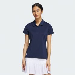 Koszulka polo Ultimate365 Solid Short Sleeve. Niebieskie koszulki damskie Adidas, bez wzorów, z materiału, bez kołnierzyka, bez ramiączek. Za 219.00 zł.