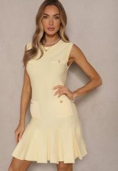 Żółta Plisowana Sukienka z Dzianiny z Wiskozą Zdobiona Imitacją Kieszeni Raviia. Żółte sukienki damskie Renee, z aplikacjami, z dzianiny, eleganckie, bez ramiączek. W wyprzedaży za 90.99 zł.