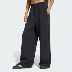 SPODNIE SOFT LUX STRAIGHT LEG. Zielone spodnie sportowe damskie Adidas, l, bez wzorów, z bawełny, na fitness i siłownię. Za 299.00 zł.