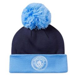 Puma Czapka Mcfc Ess Pom Pom 02561303. Niebieskie czapki damskie Puma, na zimę, bez wzorów. Za 105.60 zł.