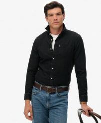Superdry Essential Koszula denim z długim rękawem z bawełny organicznej. Czarne koszule damskie Superdry, m, bez wzorów, z bawełny, klasyczne, bez kołnierzyka, bez ramiączek. Za 275.85 zł.
