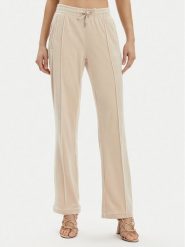 Juicy Couture Spodnie dresowe Tina JCAPW045 Beżowy Regular Fit. Brązowe spodnie dresowe damskie Juicy Couture, m, bez wzorów, z dresówki. Za 199.99 zł.