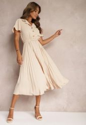 Beżowa Plisowana Rozkloszowana Sukienka z Paskiem Guzikami i Gumką w Talii Nelaika. Brązowe sukienki damskie Renee, bez wzorów, eleganckie, bez ramiączek. W wyprzedaży za 107.99 zł.
